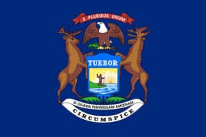 State of Michigan Seal which has two moose holding the seal with an eagle at the top.